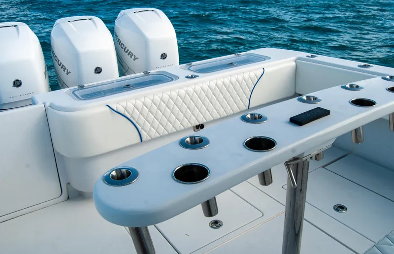 + Sea Keeper Yacht Photos Pics 2019 Contender 39 ST boat with multiple rod holders and Mercury engines on the ocean.