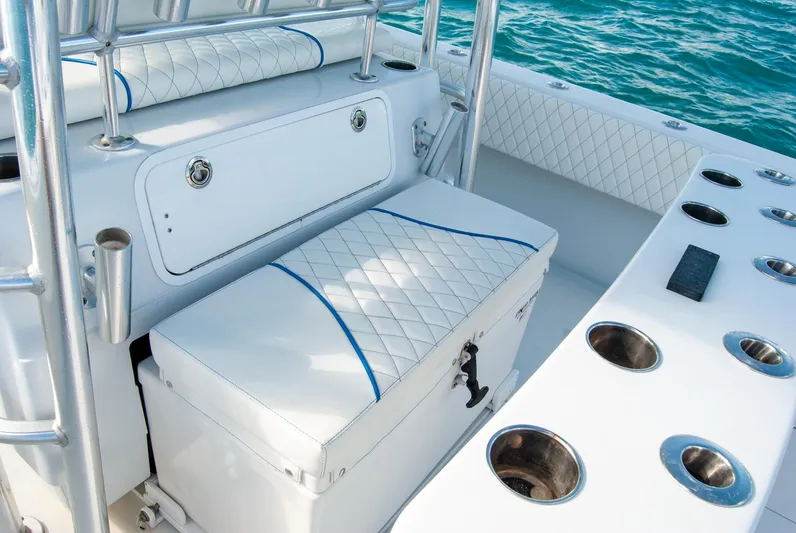 + Sea Keeper Yacht Photos Pics 2019 Contender 39 ST boat interior with cushioned seating and rod holders.