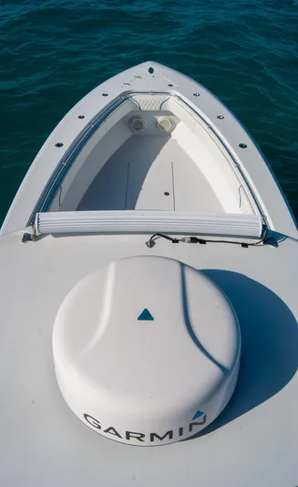+ Sea Keeper Yacht Photos Pics 2019 Contender 39 ST boat with Garmin equipment on deck, floating on clear blue water.