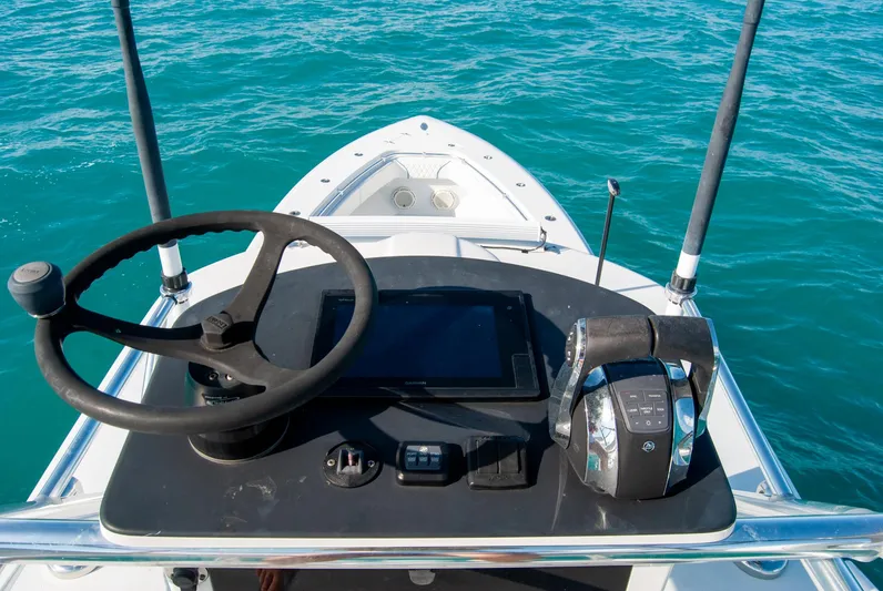 + Sea Keeper Yacht Photos Pics 2019 Contender 39 ST boat helm with steering wheel and controls on blue water.