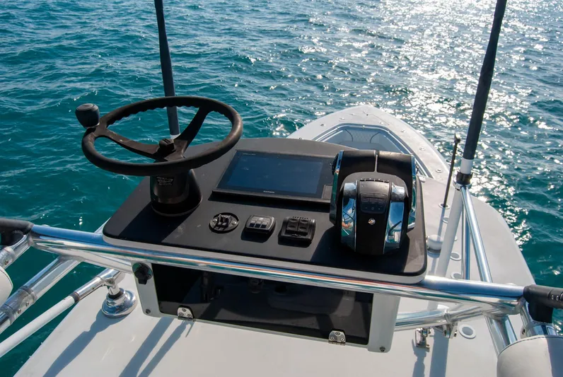 + Sea Keeper Yacht Photos Pics 2019 Contender 39 ST boat helm with steering wheel and controls on open water.