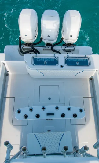 + Sea Keeper Yacht Photos Pics 2019 Contender 39 ST boat with triple outboard engines on turquoise water.