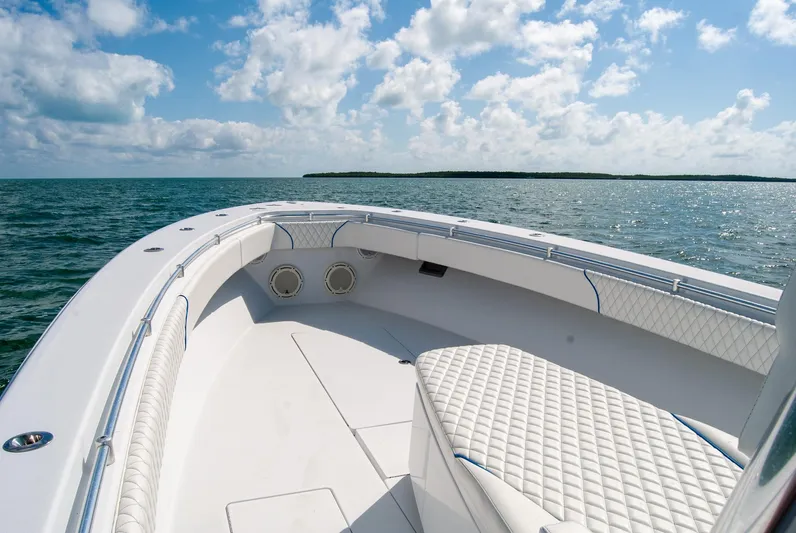 + Sea Keeper Yacht Photos Pics 2019 Contender 39 ST boat on open water, featuring spacious seating and clear skies.