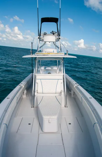+ Sea Keeper Yacht Photos Pics 2019 Contender 39 ST boat on open sea under blue sky.
