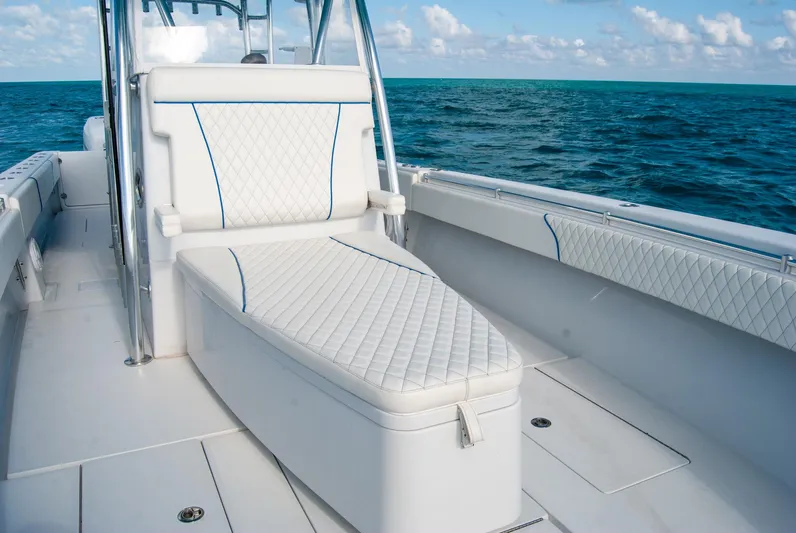 + Sea Keeper Yacht Photos Pics 2019 Contender 39 ST boat interior with cushioned seating, ocean view, and clear sky.