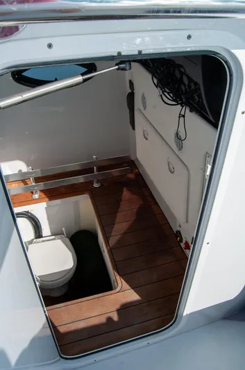 + Sea Keeper Yacht Photos Pics 2019 Contender 39 ST boat interior with wooden flooring and compact toilet.