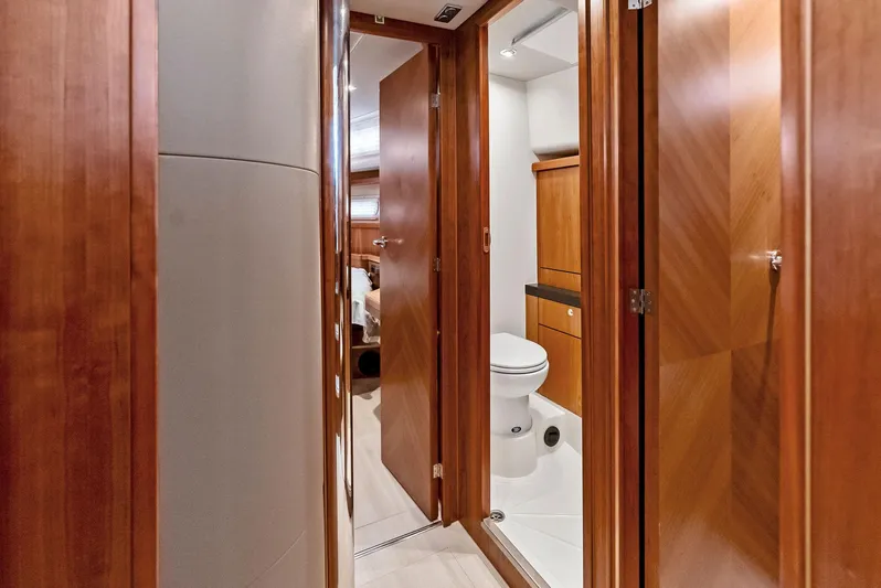 Southwind Yacht Photos Pics Interior of 2021 Moody 45 DS yacht showing hallway and bathroom with wooden finishes.