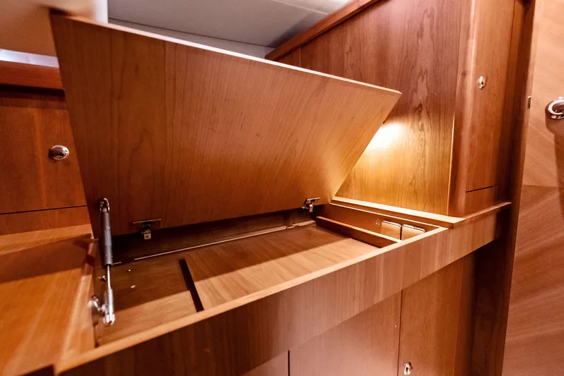 Southwind Yacht Photos Pics Wooden storage compartment in the 2021 Moody 45 DS yacht interior.