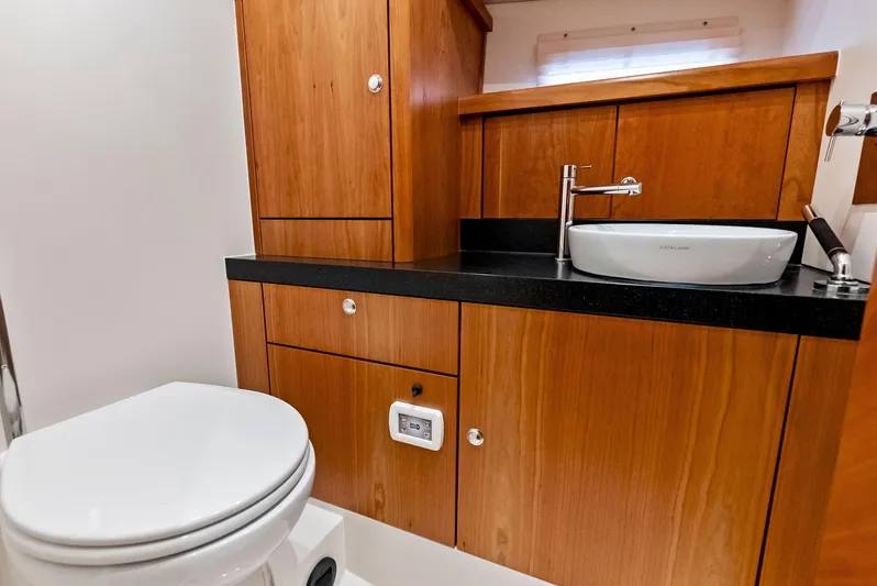 Southwind Yacht Photos Pics Modern bathroom in 2021 Moody 45 DS yacht with wooden cabinetry and sleek fixtures.