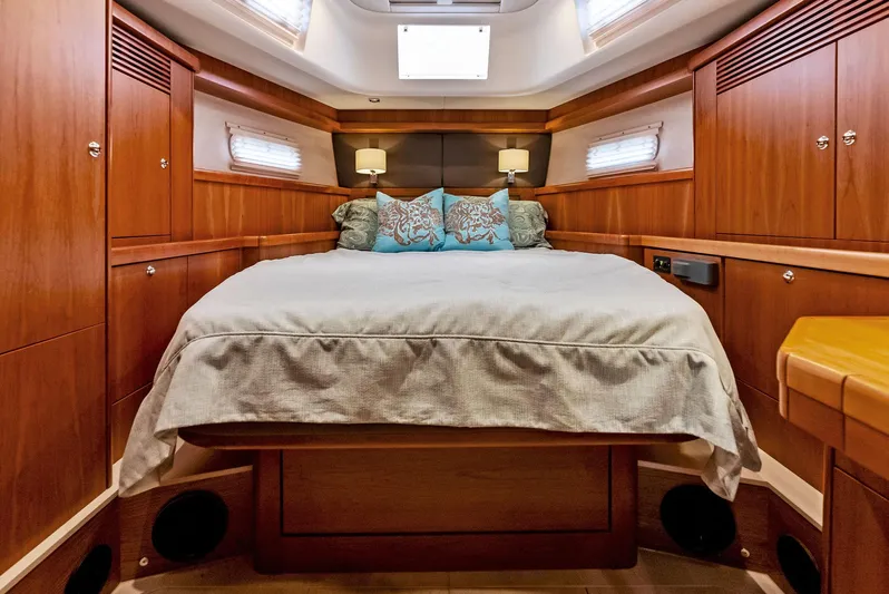 Southwind Yacht Photos Pics Luxurious cabin interior of 2021 Moody 45 DS yacht with cozy bed and wooden finish.