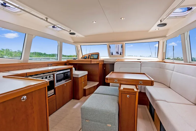 Southwind Yacht Photos Pics Modern interior of 2021 Moody 45 DS yacht with spacious seating and kitchen area.