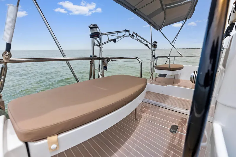 Southwind Yacht Photos Pics 2021 Moody 45 DS yacht deck with cushioned seating and ocean view.