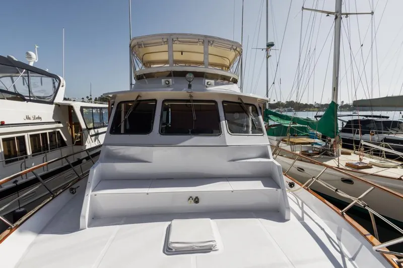 Betelgeuse Yacht Photos Pics 1988 DeFever 53 POC yacht docked at marina, front view.