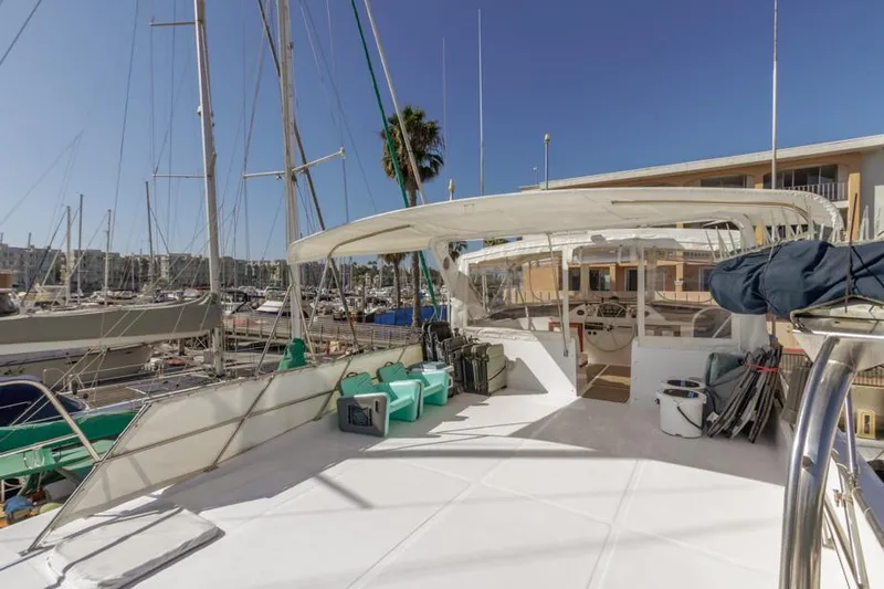 Betelgeuse Yacht Photos Pics 1988 DeFever 53 POC yacht deck with marina view and clear blue sky.