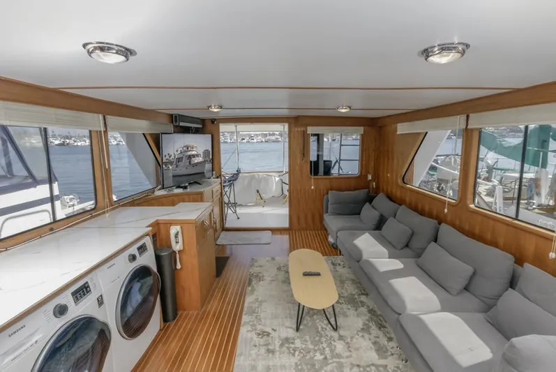 Betelgeuse Yacht Photos Pics Spacious interior of 1988 DeFever 53 POC yacht with modern amenities and waterfront views.