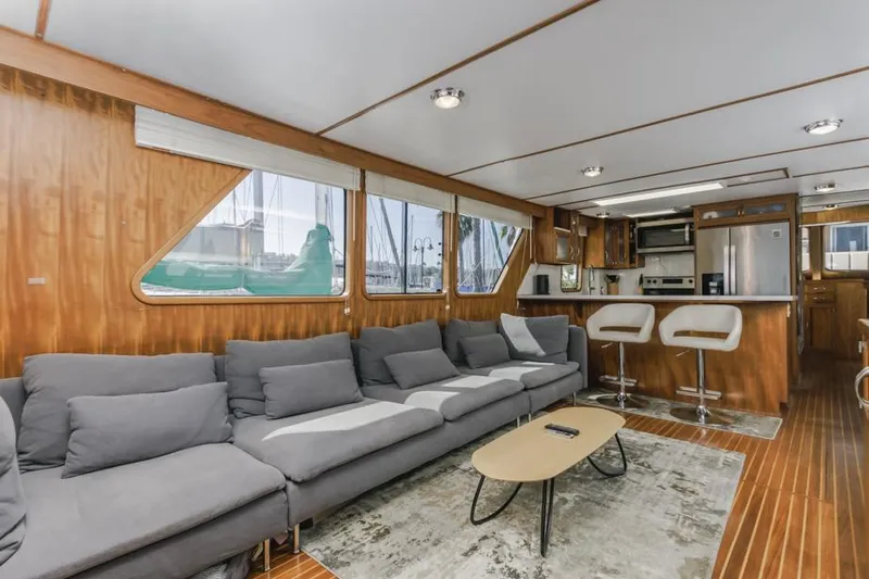 Betelgeuse Yacht Photos Pics Luxurious 1988 DeFever 53 POC yacht interior with modern kitchen and comfortable seating.