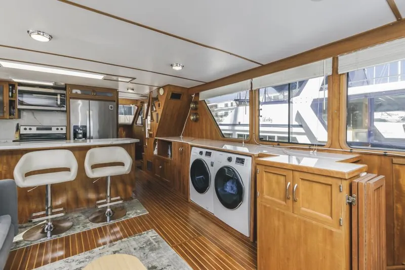 Betelgeuse Yacht Photos Pics Interior of 1988 DeFever 53 POC yacht with modern kitchen and laundry area.