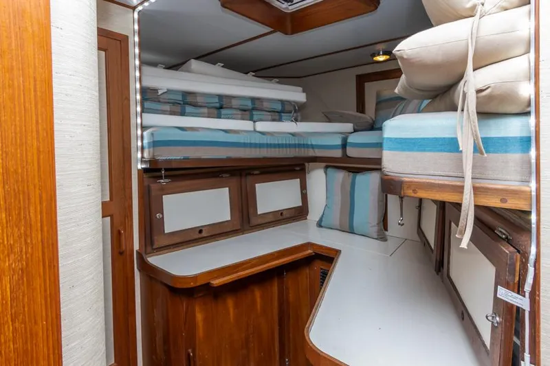 Betelgeuse Yacht Photos Pics 1988 DeFever 53 POC yacht interior with bunk beds and wooden cabinetry.