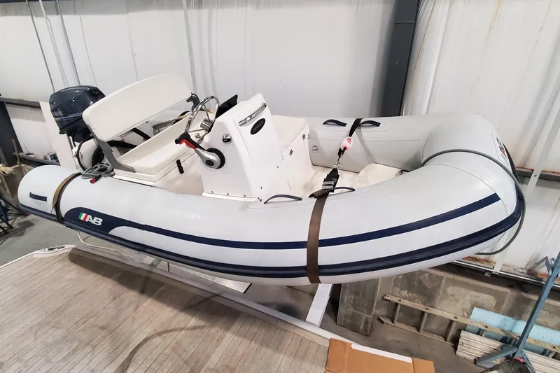 Ripple Yacht Photos Pics Inflatable boat on Sabre 45 Salon Express 2021, secured with straps in a storage area.