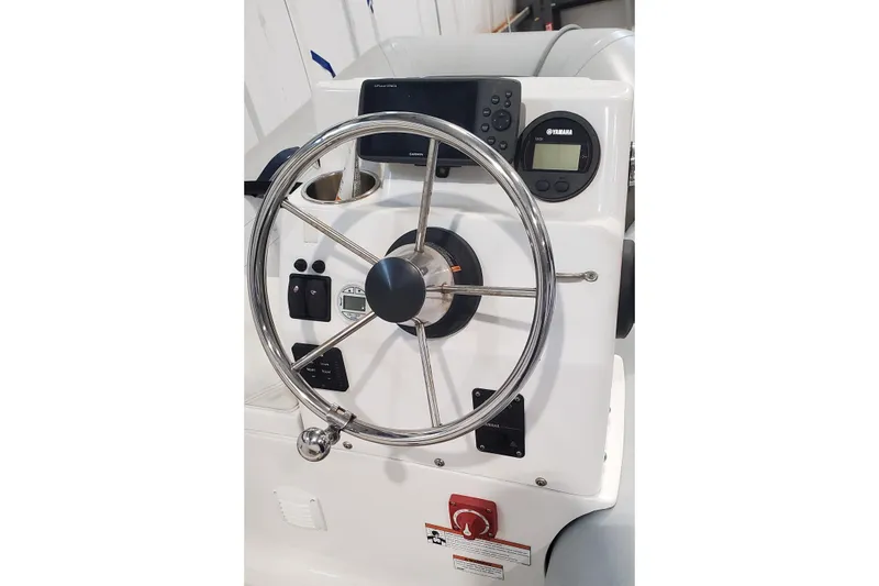 Ripple Yacht Photos Pics 2021 Sabre 45 Salon Express helm with steering wheel and navigation controls.