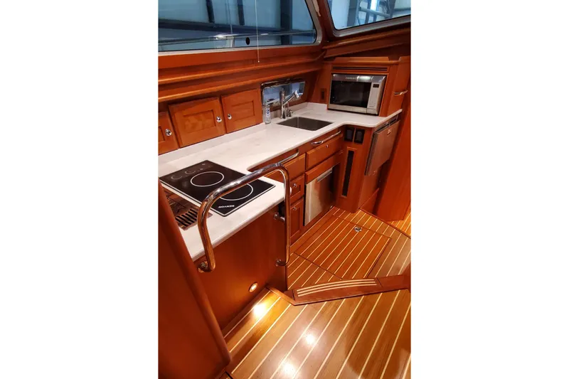 Ripple Yacht Photos Pics Luxurious kitchen interior of 2021 Sabre 45 Salon Express yacht with modern appliances.