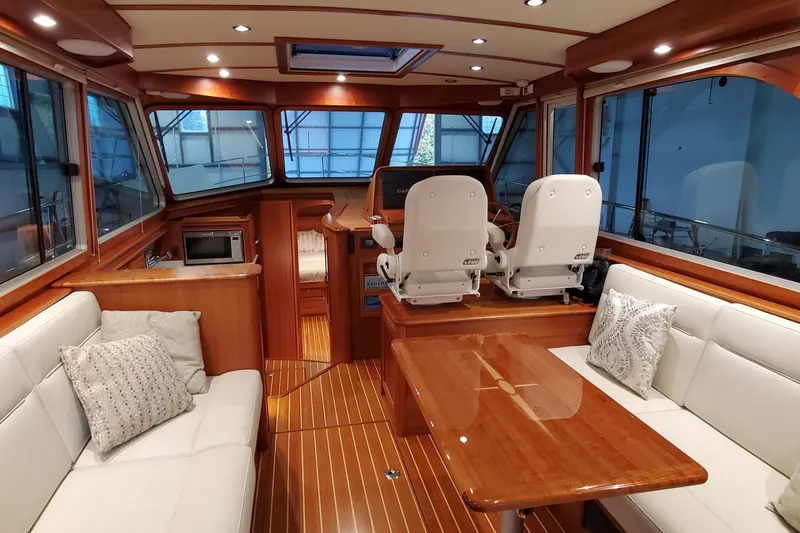 Ripple Yacht Photos Pics Interior of 2021 Sabre 45 Salon Express yacht with elegant wood finish and plush seating.