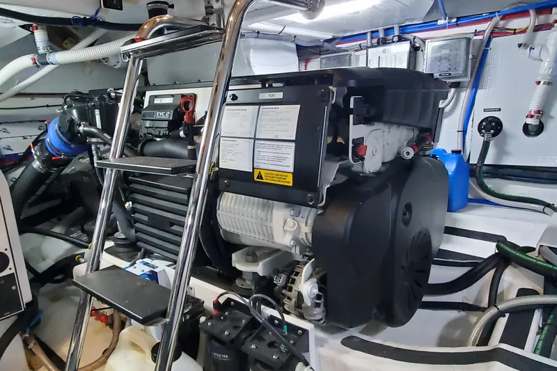 Ripple Yacht Photos Pics Engine room of 2021 Sabre 45 Salon Express with visible machinery and ladder.
