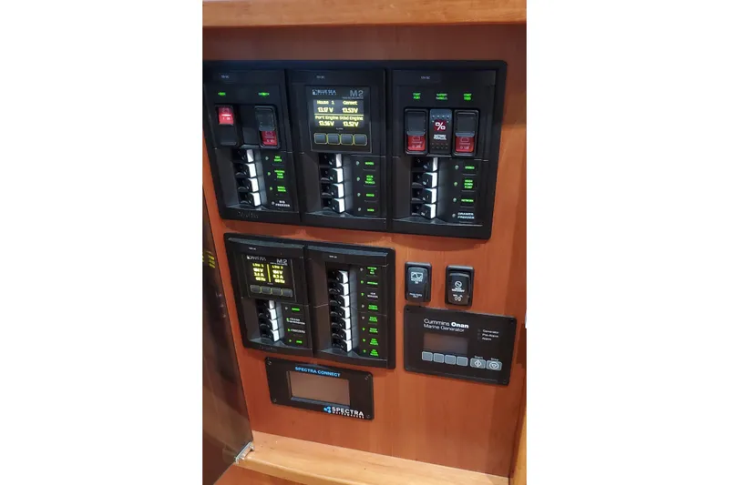Ripple Yacht Photos Pics Electrical control panel on 2021 Sabre 45 Salon Express yacht, featuring various switches and displays.