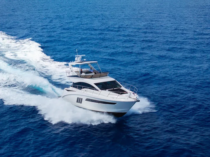 Get'er Done! Yacht Photos Pics 2016 Sea Ray 510 Fly yacht cruising on open blue water.