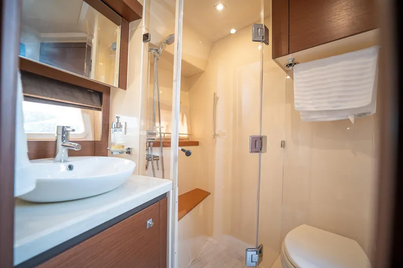 Get'er Done! Yacht Photos Pics Modern bathroom in 2016 Sea Ray 510 Fly yacht with glass shower and sink.
