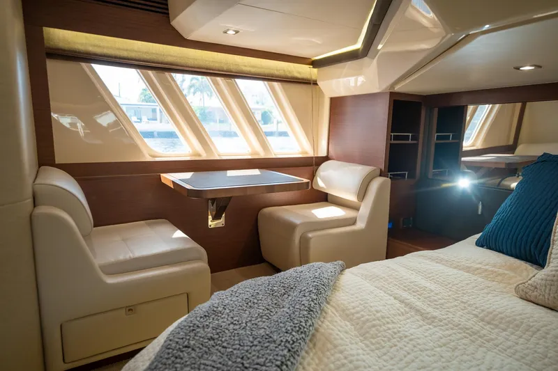 Get'er Done! Yacht Photos Pics Luxurious interior of 2016 Sea Ray 510 Fly yacht with seating and table.