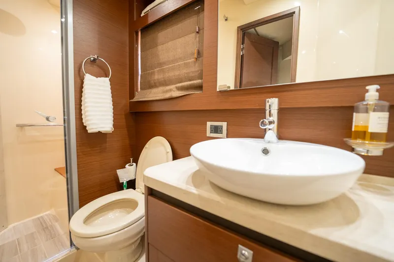 Get'er Done! Yacht Photos Pics Modern bathroom in 2016 Sea Ray 510 Fly yacht with sink, toilet, and shower.