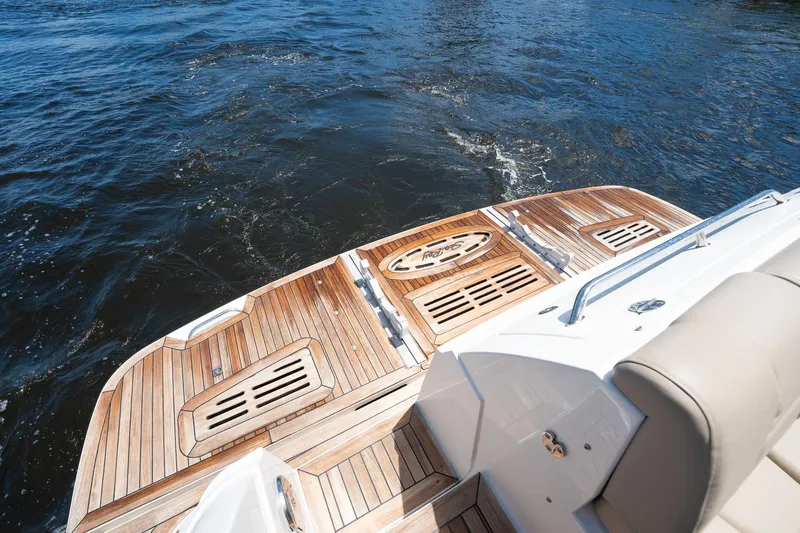 Get'er Done! Yacht Photos Pics 2016 Sea Ray 510 Fly yacht with teak swim platform on water.