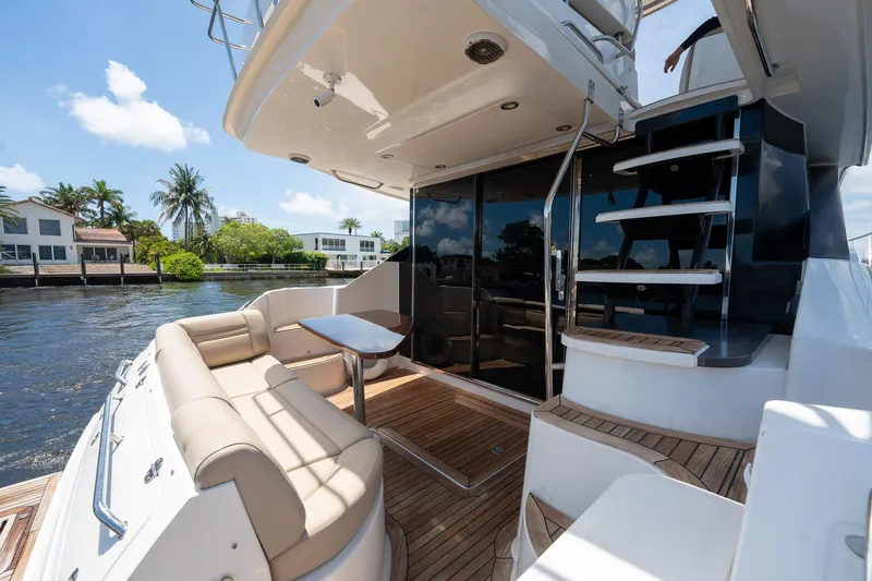 Get'er Done! Yacht Photos Pics 2016 Sea Ray 510 Fly yacht with outdoor seating and staircase.