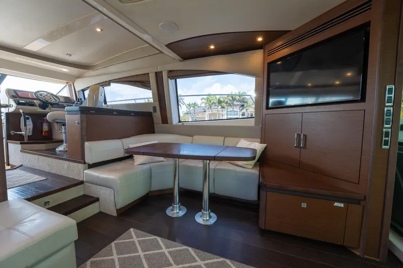 Get'er Done! Yacht Photos Pics Interior of 2016 Sea Ray 510 Fly yacht with dining area and TV.