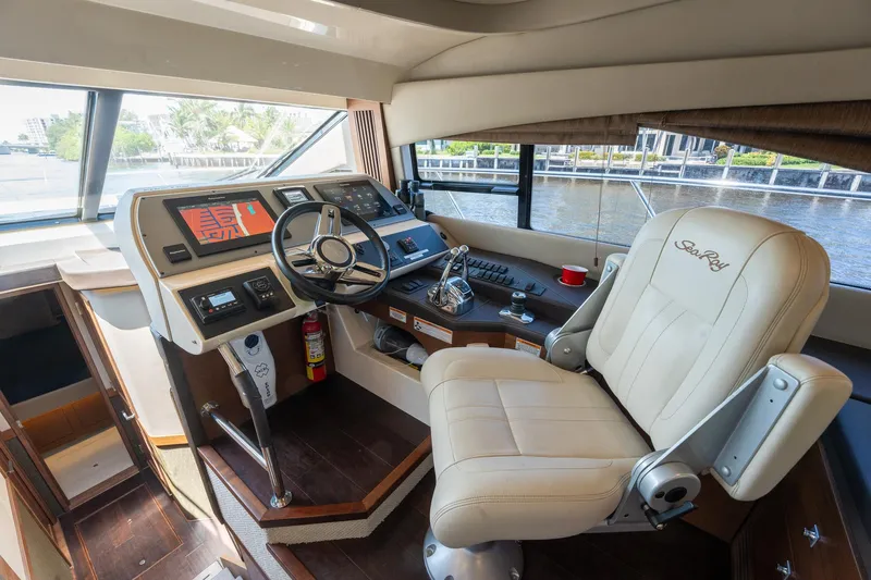Get'er Done! Yacht Photos Pics Helm station of 2016 Sea Ray 510 Fly yacht with leather captain's chair.