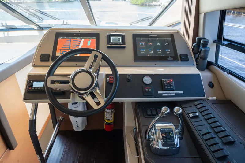 Get'er Done! Yacht Photos Pics Helm station of 2016 Sea Ray 510 Fly yacht with modern controls and navigation screens.