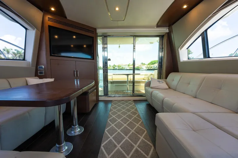 Get'er Done! Yacht Photos Pics Luxurious interior of 2016 Sea Ray 510 Fly yacht with modern furnishings and large windows.