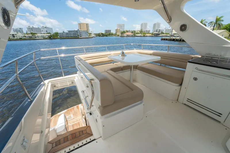 Get'er Done! Yacht Photos Pics 2016 Sea Ray 510 Fly yacht with spacious outdoor seating and scenic water view.