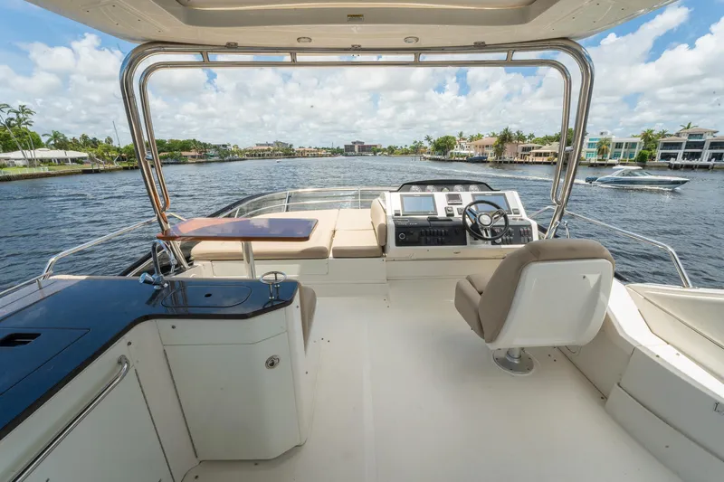 Get'er Done! Yacht Photos Pics 2016 Sea Ray 510 Flybridge yacht interior with helm, seating, and waterfront view.