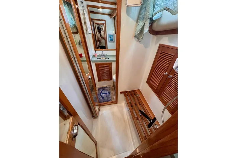 Necessity Yacht Photos Pics 2005 Albin 45 Command Bridge bathroom with wooden accents and compact design.