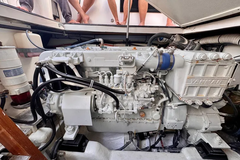 Necessity Yacht Photos Pics Engine compartment of a 2005 Albin 45 Command Bridge boat, featuring a Yanmar engine.