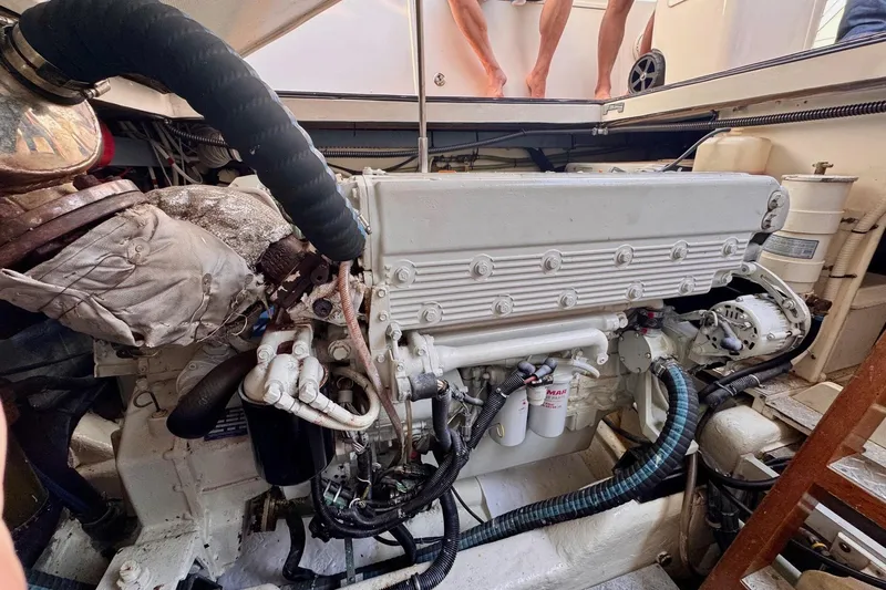 Necessity Yacht Photos Pics Engine compartment of a 2005 Albin 45 Command Bridge boat, showcasing detailed machinery.