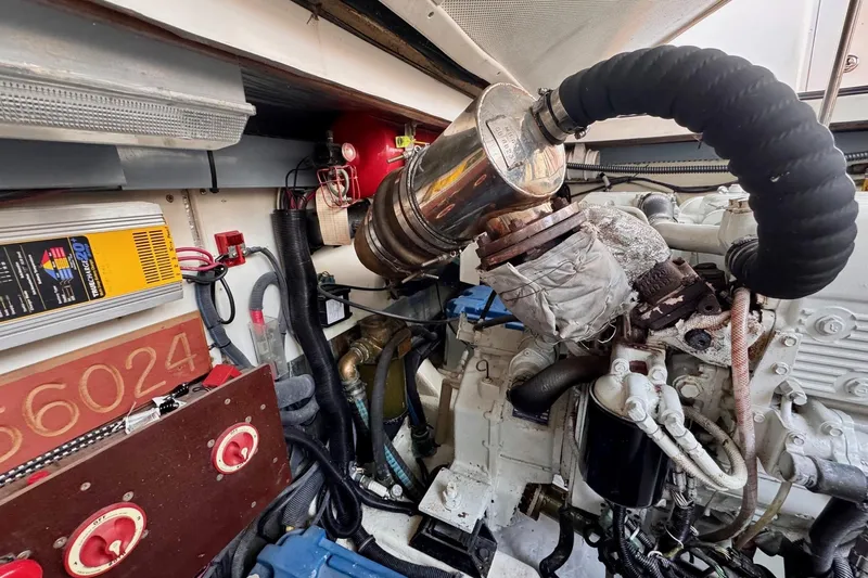 Necessity Yacht Photos Pics Engine room of a 2005 Albin 45 Command Bridge, showcasing mechanical components and wiring.