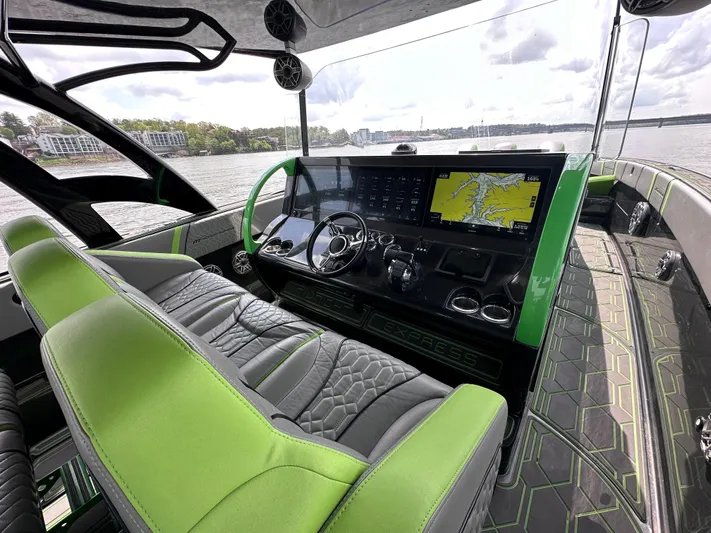  Yacht Photos Pics Luxurious 2022 Midnight Express 43' Solstice boat interior with green accents and advanced navigation system.