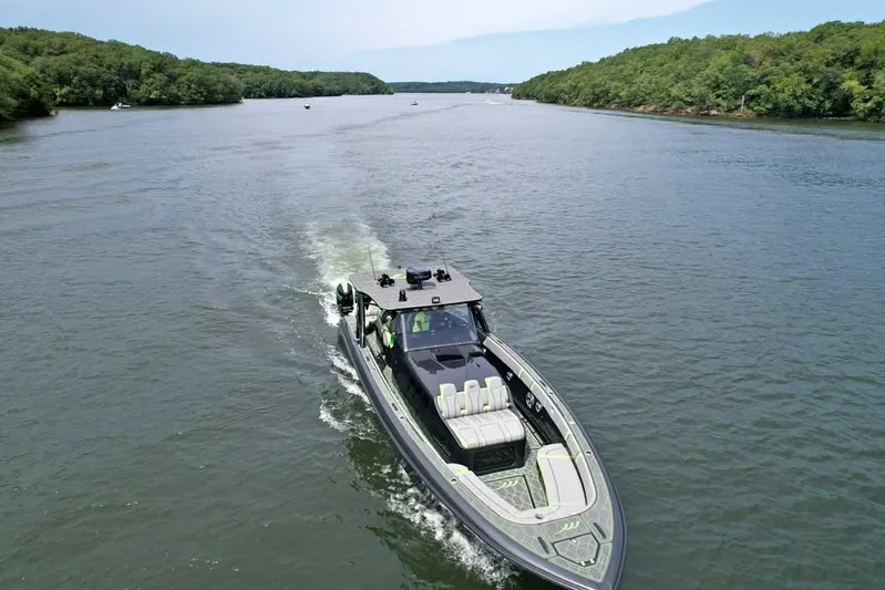  Yacht Photos Pics 2022 Midnight Express 43' Solstice cruising on a scenic river.