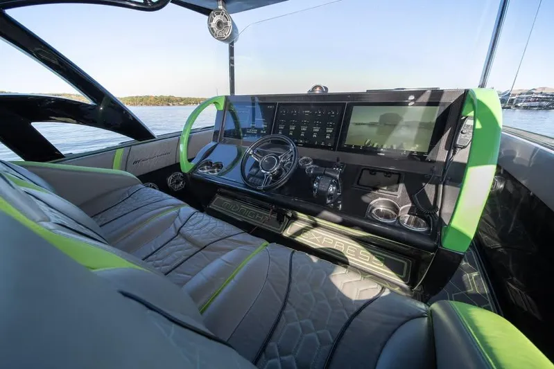  Yacht Photos Pics Cockpit of 2022 Midnight Express 43' Solstice with modern controls and green accents.