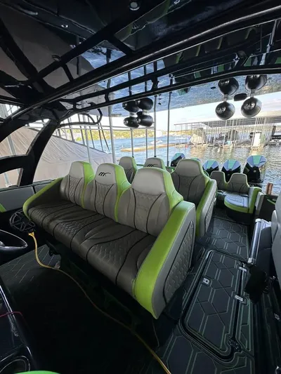  Yacht Photos Pics Luxurious interior of 2022 Midnight Express 43' Solstice boat with stylish seating and modern design.