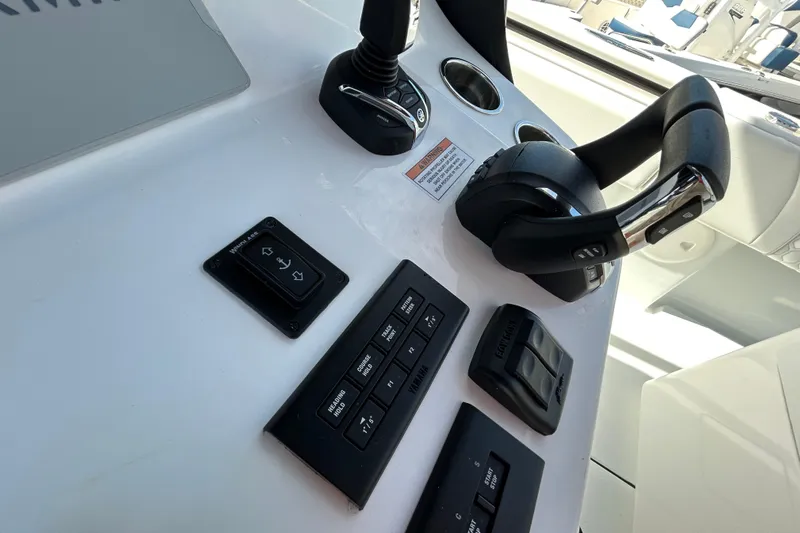  Yacht Photos Pics Control panel of 2026 Contender 35 ST boat with modern switches and throttle.