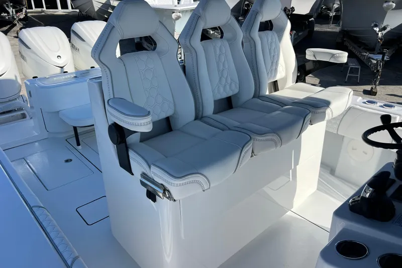  Yacht Photos Pics 2026 Contender 35 ST boat interior with luxurious white seating and modern design.